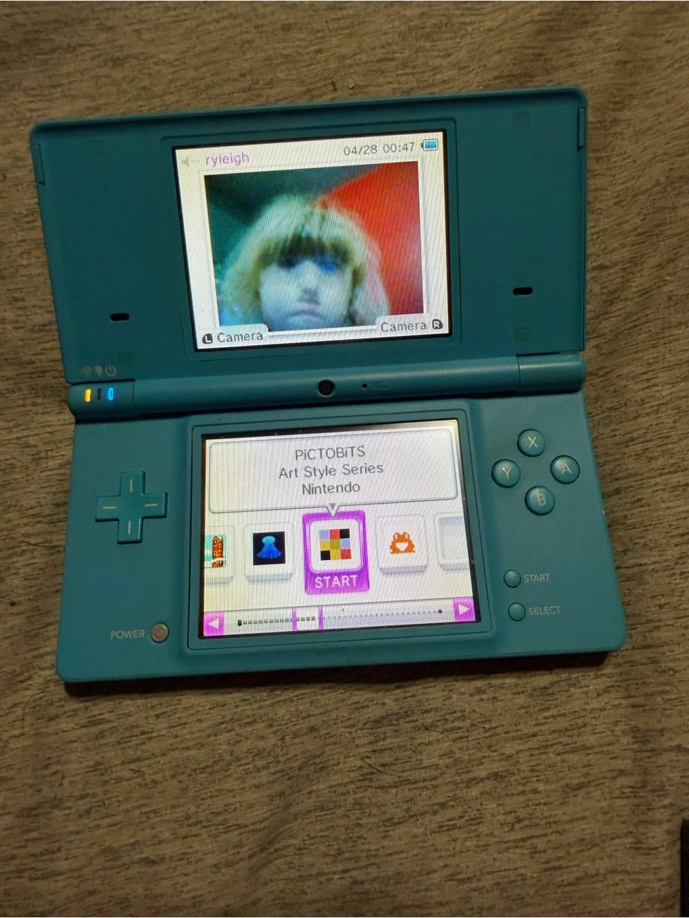 Nintendo Turquoise Blue DSi with Games, Stylus, Case and charger.
